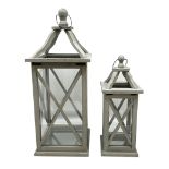 Two wooden lanterns with four glass sides
