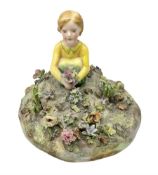 Crown Staffordshire figure modelled as a child in a garden