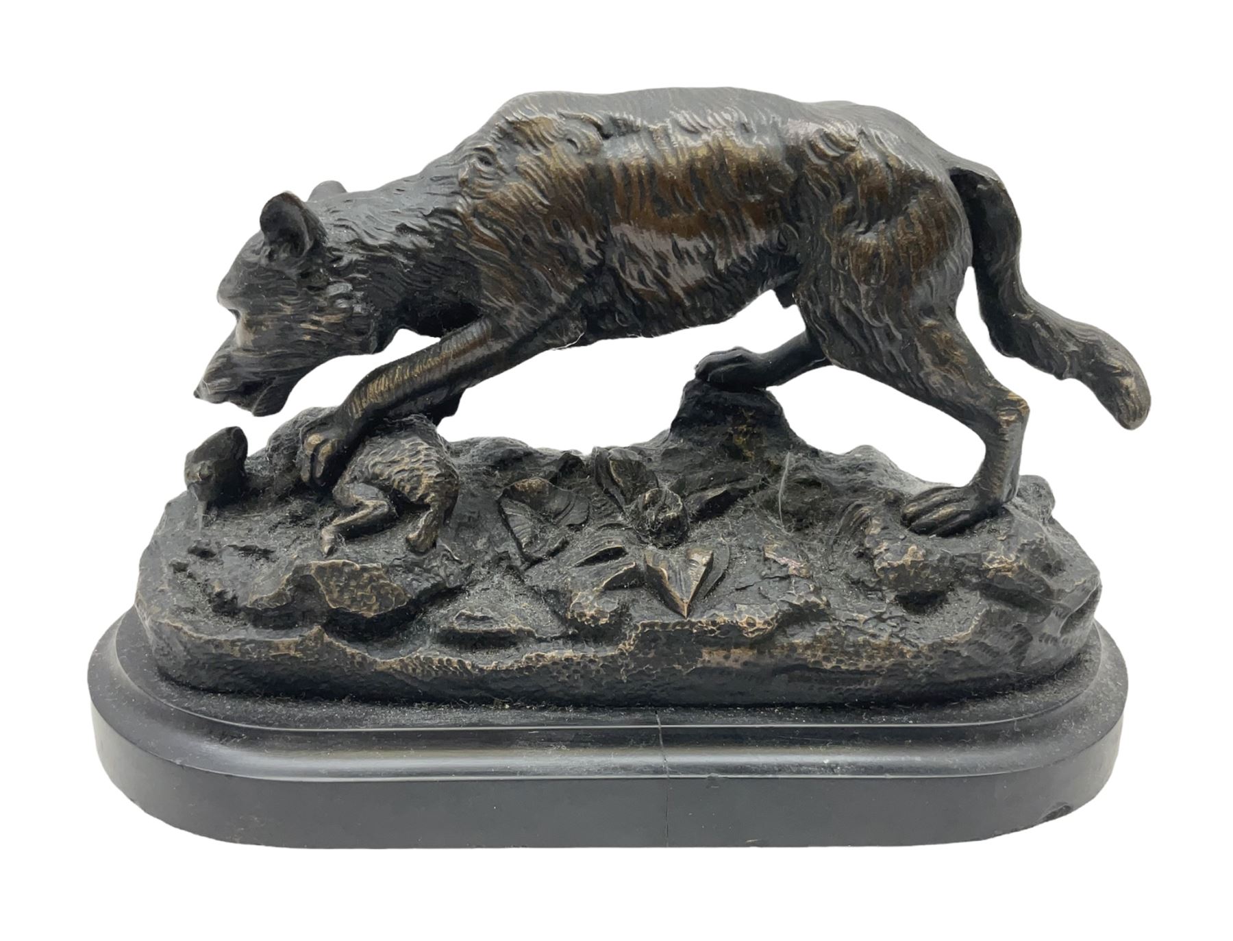 Bronze figure of a wolf with lamb prey