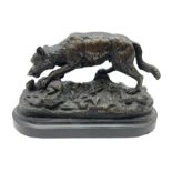 Bronze figure of a wolf with lamb prey