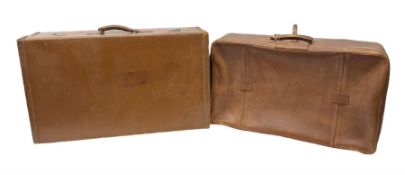 Two 20th century tan leather suitcases together with Lark violin and bow