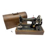 Singer sewing machine in wood case with key