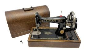 Singer sewing machine in wood case with key