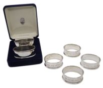 Set of four modern silver napkin rings