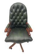 Swivel reclining desk chair upholstered in green buttoned leather