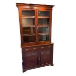 Late Victorian mahogany glazed bookcase on cupboard