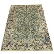 Persian Kashan pale green ground carpet