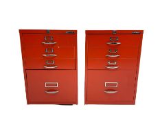 Two red finish 'Bisley' four drawer filing cabinet