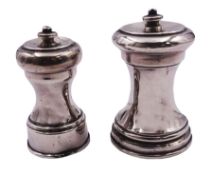 Two silver pepper grinders