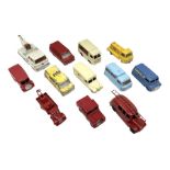 Dinky - twelve unboxed and playworn/repainted die-cast commercial vehicles comprising Daimler Ambula