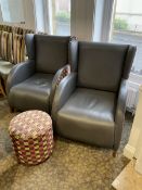 Two curved wing back armchairs