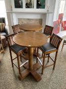 Two circular walnut finish high bar stools, and four stools with charcoal leather seats- LOT SUBJECT