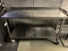 Stainless steel two tier preparation table, on castors, raised back- LOT SUBJECT TO VAT ON THE