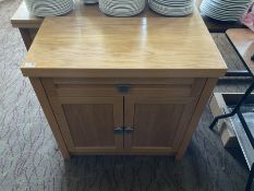 Light oak two door cabinet and a side table with two drawers- LOT SUBJECT TO VAT ON THE HAMMER PRICE