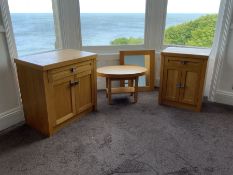 Two light oak side cabinets, oval table and wall mirror- LOT SUBJECT TO VAT ON THE HAMMER PRICE - To