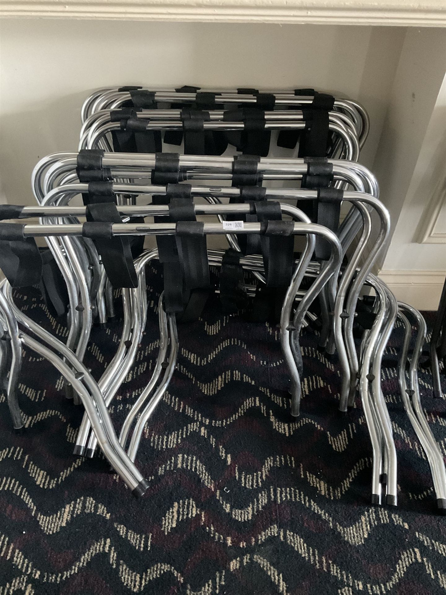 Sixteen folding luggage stands (16)- LOT SUBJECT TO VAT ON THE HAMMER PRICE - To be collected by app