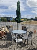 Grey aluminium circular glass top garden table