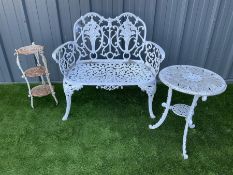 White painted aluminium garden bench together with an aluminium table of similar design and a three