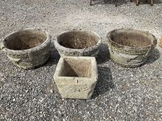 Set of three cast stone circular garden planters