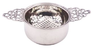 Mid 20th century silver tea strainer and stand