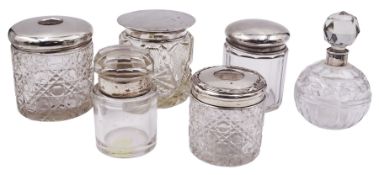 Group of silver mounted glass dressing table jars and bottles