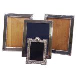 Four silver mounted photograph frames