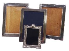 Four silver mounted photograph frames