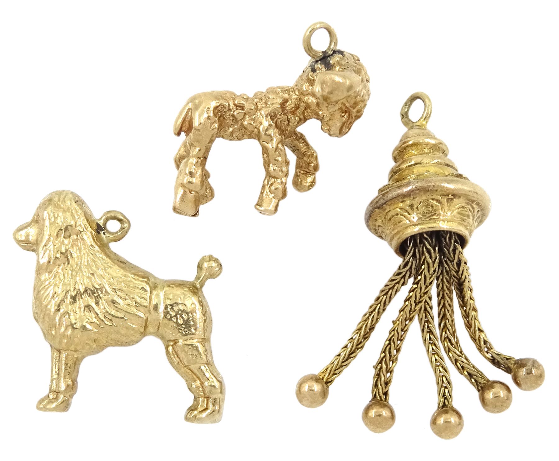 Three 9ct gold pendant/charms including poodle