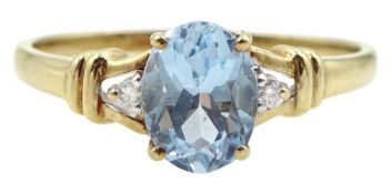 9ct gold three stone oval blue topaz and diamond ring