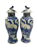 Pair of later 19th century Chinese blue and white vases and covers of baluster form