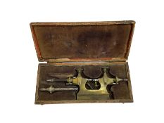 Early 20th century brass watchmakers pivoting tool in original velvet lined box with attachments.