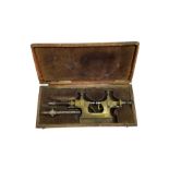 Early 20th century brass watchmakers pivoting tool in original velvet lined box with attachments.