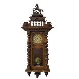 1890's German striking wall clock in a walnut case