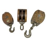 Three ship pulleys comprising wooden block double with stiff swivel hook