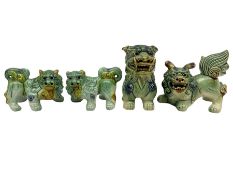 Group of four Chinese Foo dog in traditional green