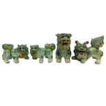 Group of four Chinese Foo dog in traditional green