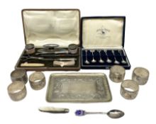 Cased manicure set with silver mounted accessories and covers to jars