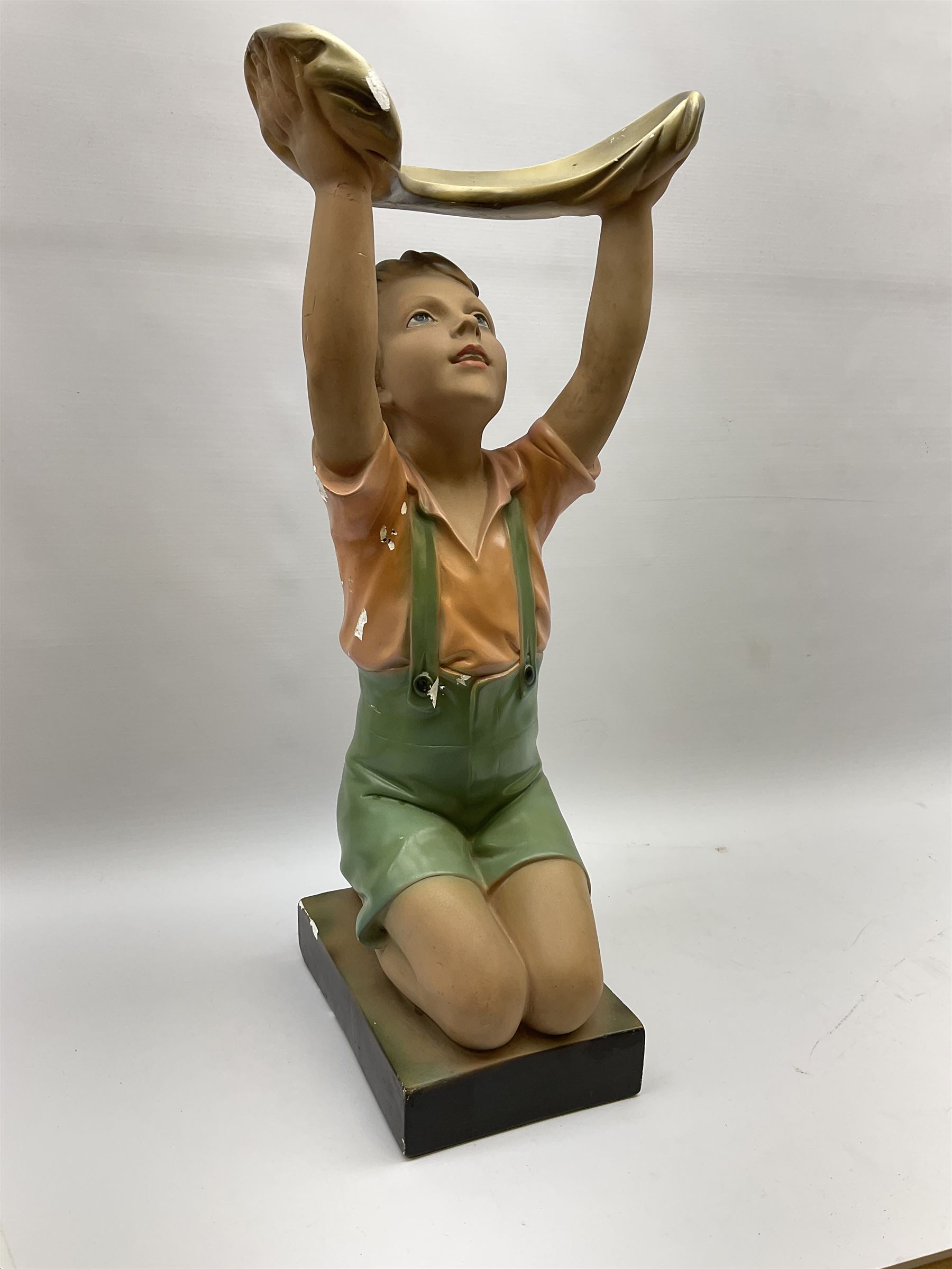 Art Deco plaster figure modelled as a young boy kneeling with his arms above his head holding a dish - Image 2 of 4