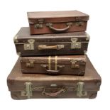 Four vintage suitcases of various sizes