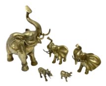 Set of five brass elephants