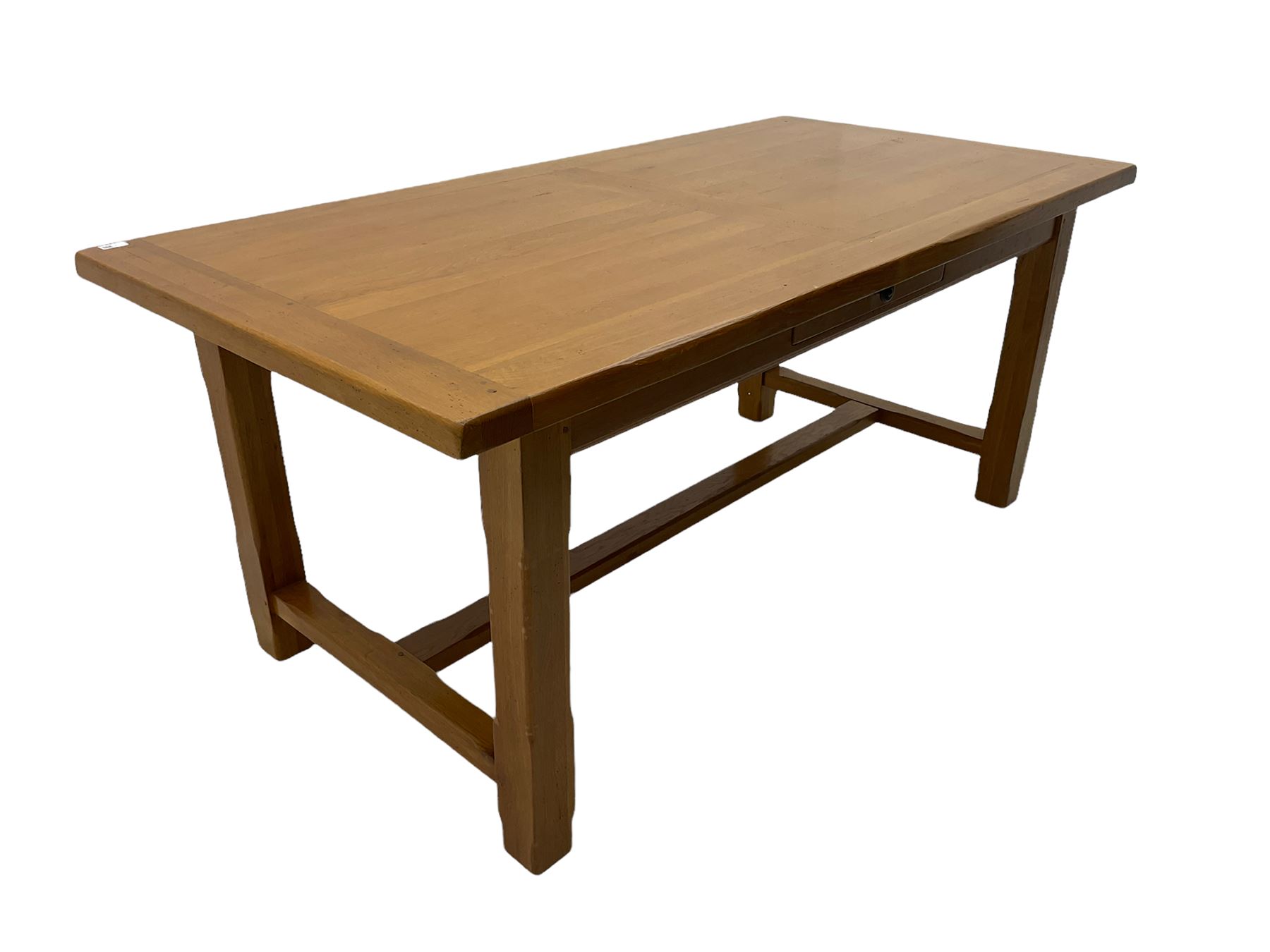 Light oak rectangular dining table with two additional leaves