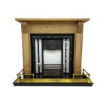 Cast metal fireplace in pine surround