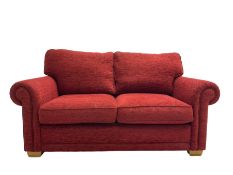 Two seat metal actions sofa bed upholstered in red cover