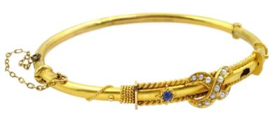 Early 20th century 15ct gold sapphire and split pearl hinged bangle