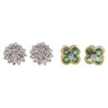 Pair of gold emerald and diamond flower head cluster stud earrings and one other pair of gold diamon