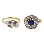 Gold three stone cubic zirconia ring and a gold blue and clear stone set cluster ring