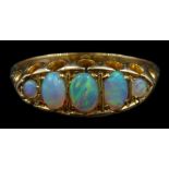 Early 20th century 18ct gold graduating opal ring