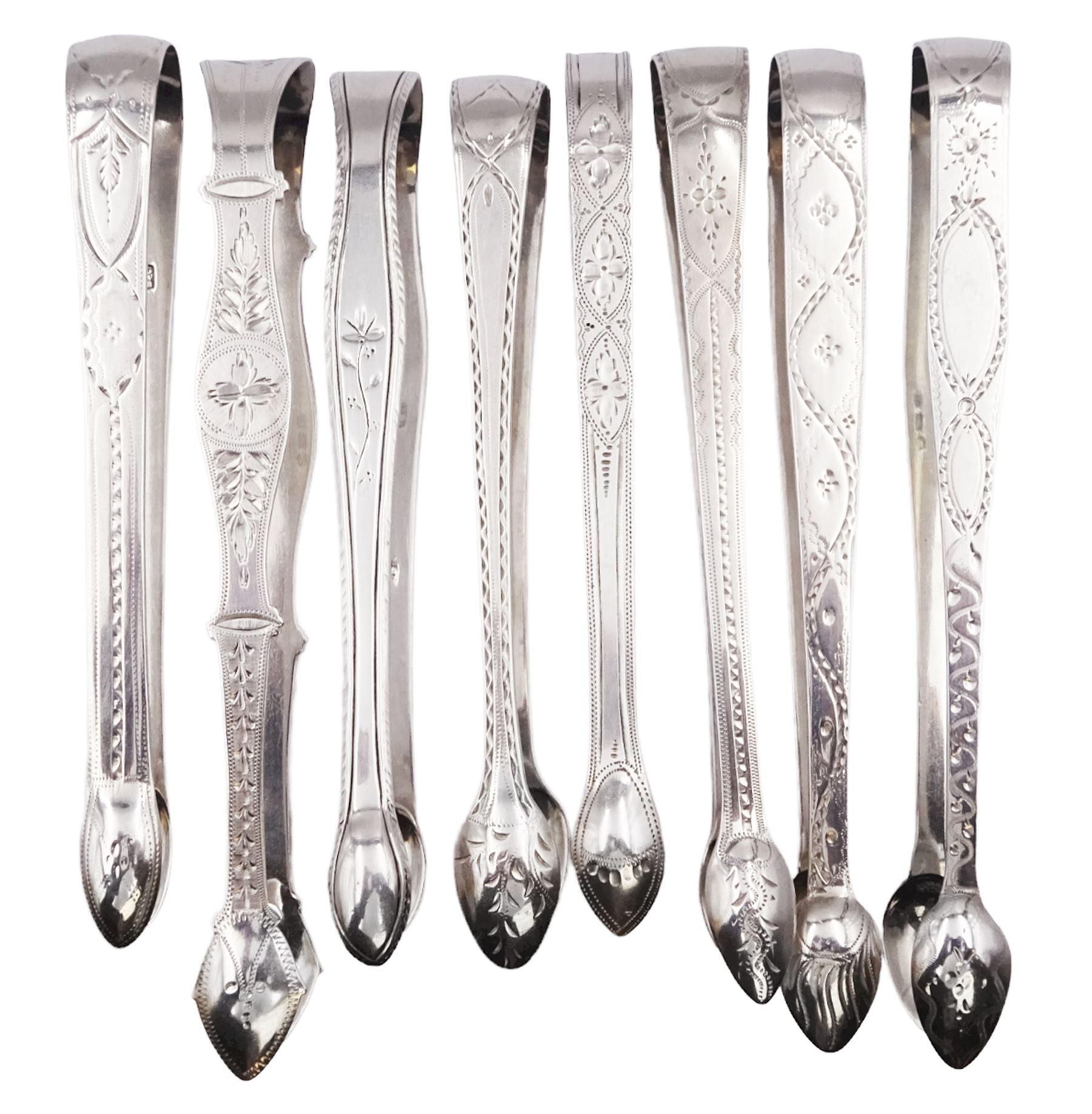 Collection of eight George III silver bright cut engraved sugar tongs - Image 2 of 3