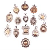 Fourteen silver fobs of various form