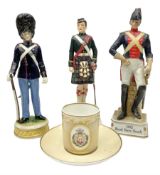 Three soldier figures comprising ?Rudolf K�mmer Volkstedt figure of Den Kgl. Danske Livgarde